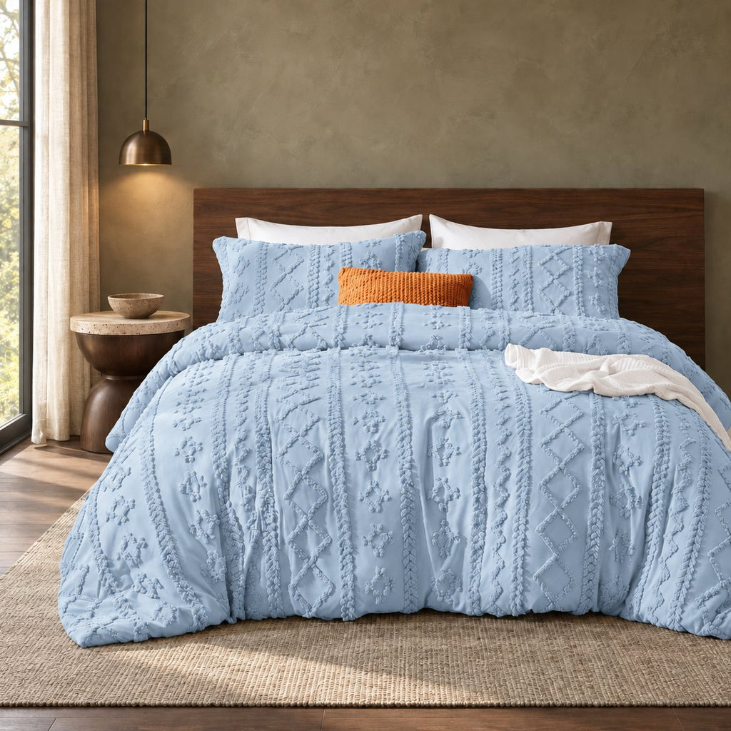 Dusty Blue tufted comforter set on a bed