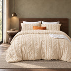 Oatmilk tufted comforter set on a bed