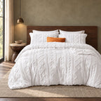 White tufted comforter set on a bed