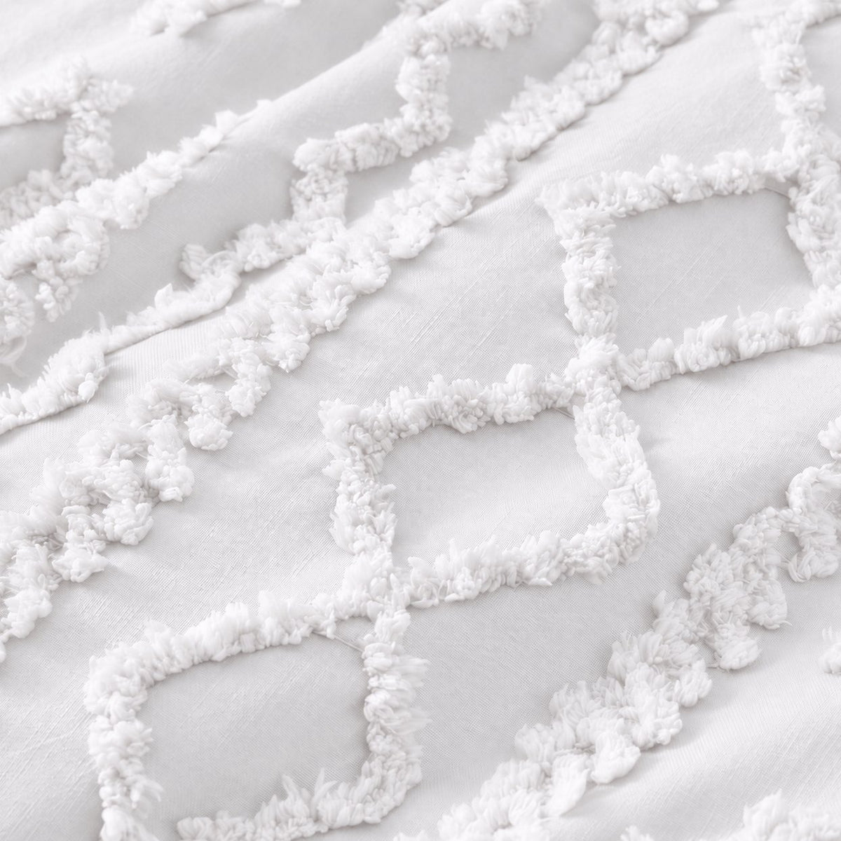 Tufted comforter detail, White